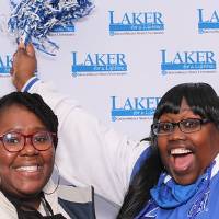 Two women celebrating homecoming